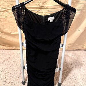 Black mini dress made of sheer voile fabric, short sleeves, full zipper back